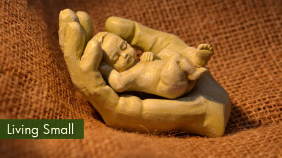 figurine of tiny baby in hand